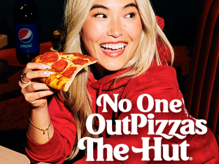 ph_pos_th No one out pizzas the Hut, woman eating slice of pizza
